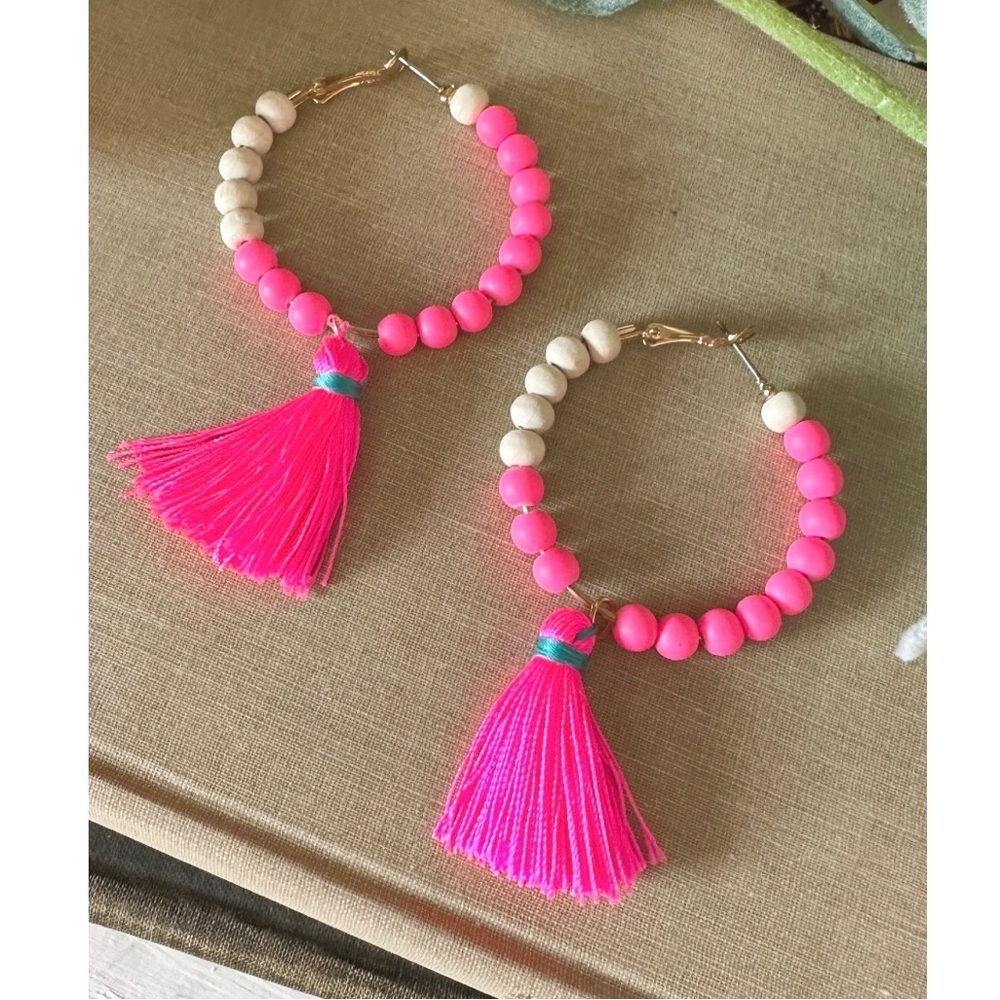 Neon pink tassel hoops